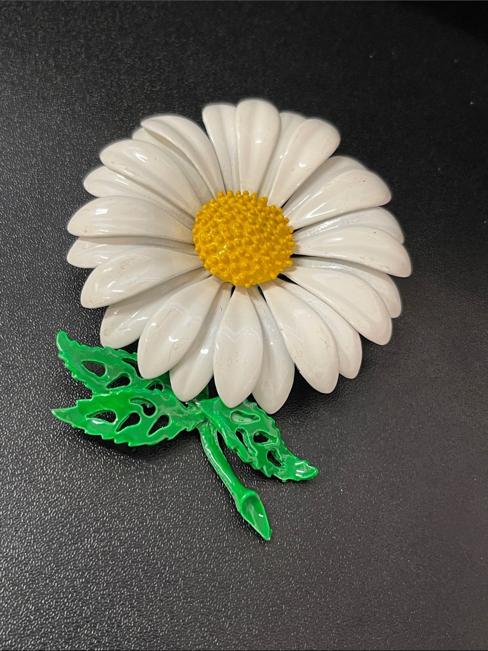 White Daisy Flower Brooch with Yellow Center and Green Leaves
